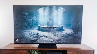 A TCL QM7K QD-Mini LED TV on a side table