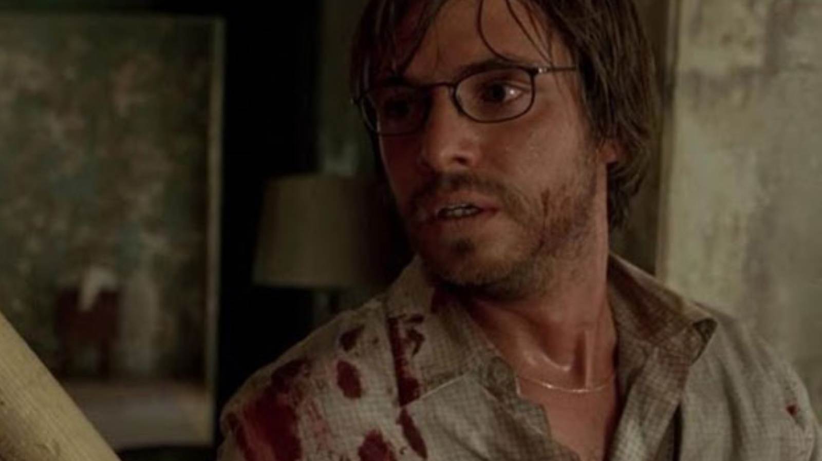 Aaron Stanford as Doug holding a baseball bat