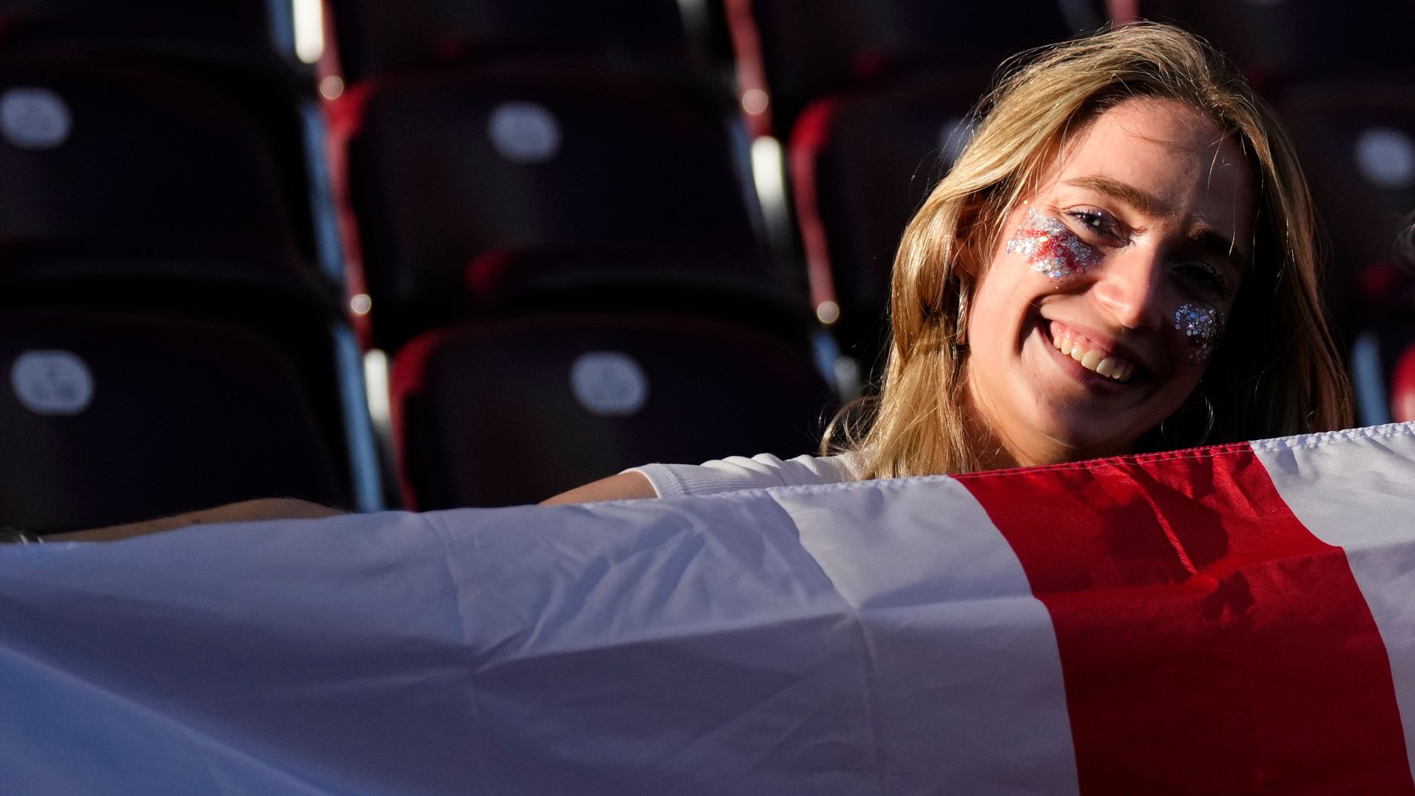 A female fan watching the England vs Spain Women's Euros final in Switzerland