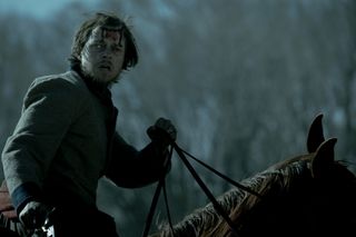 dane dehaan riding on a horse as jacob pratt in a still from the tv show american primeval