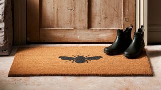 coir doormat with bee design