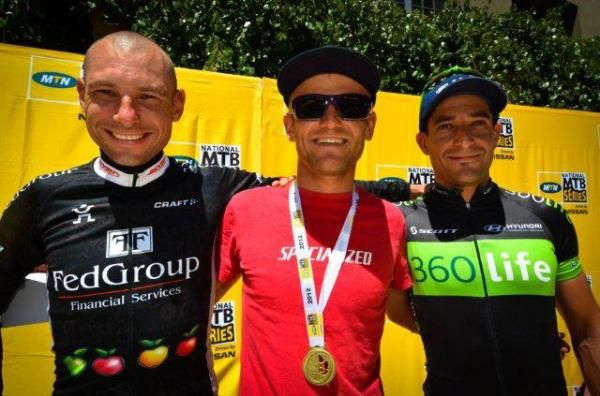 Elite men's podium: From left: Jacques Rossouw (third), Burry Stander (first) and Kevin Evans (second).