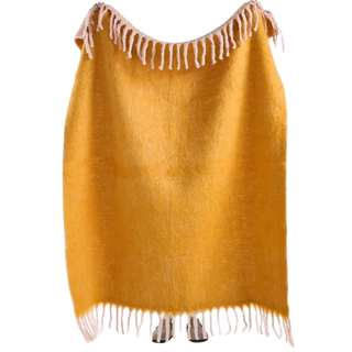 yellow throw with fringed detail