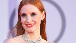 Jessica Chastain wearing smudgy kohl makeup with red lipstick