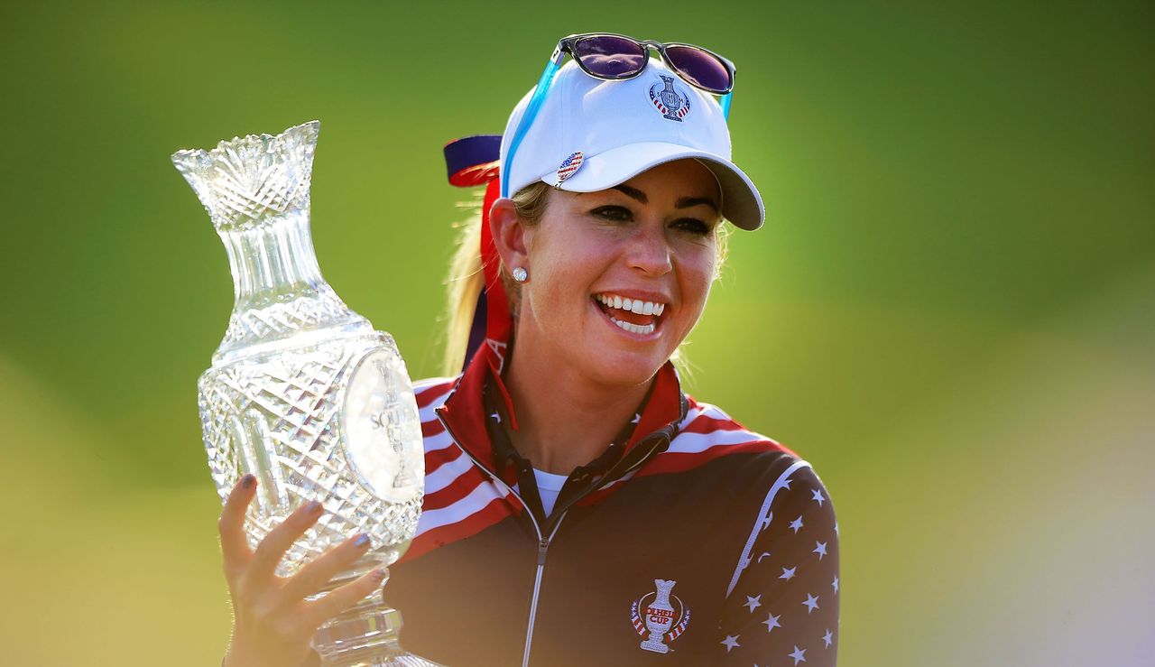 Paula Creamer holds the Solheim Cup a loft