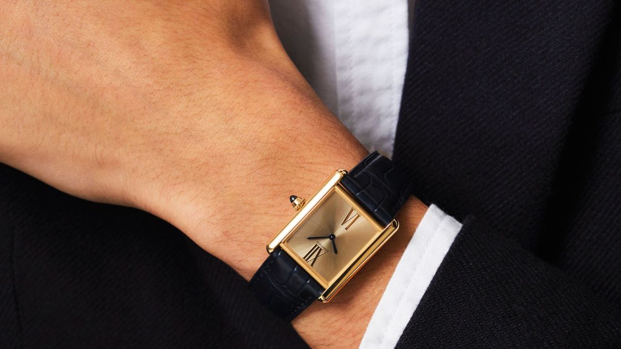 Cartier watch on man&#039;s wrist