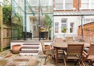 terrace with glass door and wooden table