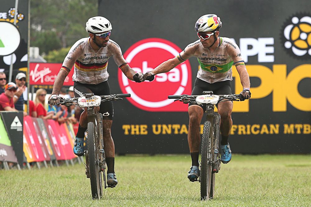 Manuel Fumic and Henrique Avancini of Cannondale Factory Racing celebrate second place on stage 1 of the 2019 Absa Cape Epic Mountain Bike stage race