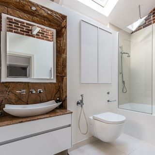 white bathroom with washbasin and shower