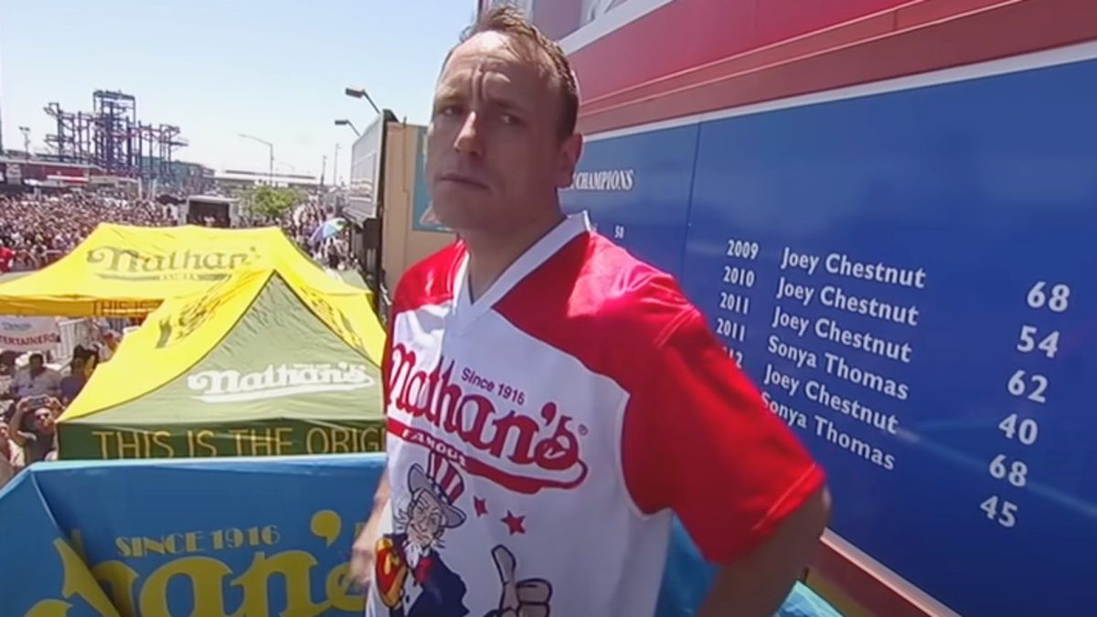 Joey Chestnut stretching before hot dog eating competition that was boradcast on ESPN in 2019.