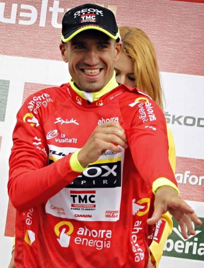 Juan Jose Cobo dons the red jersey.