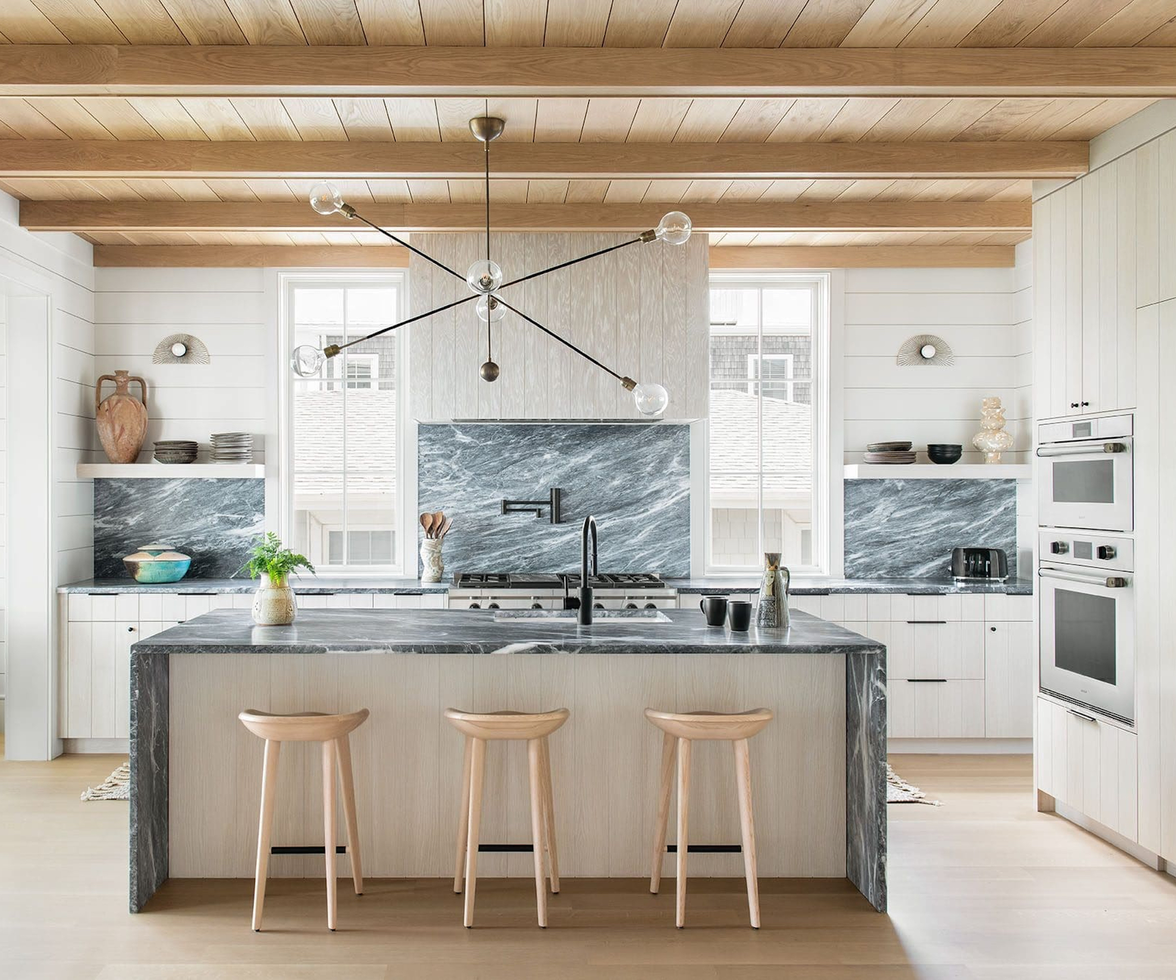 kitchen cabinets in off-white with wood floors
