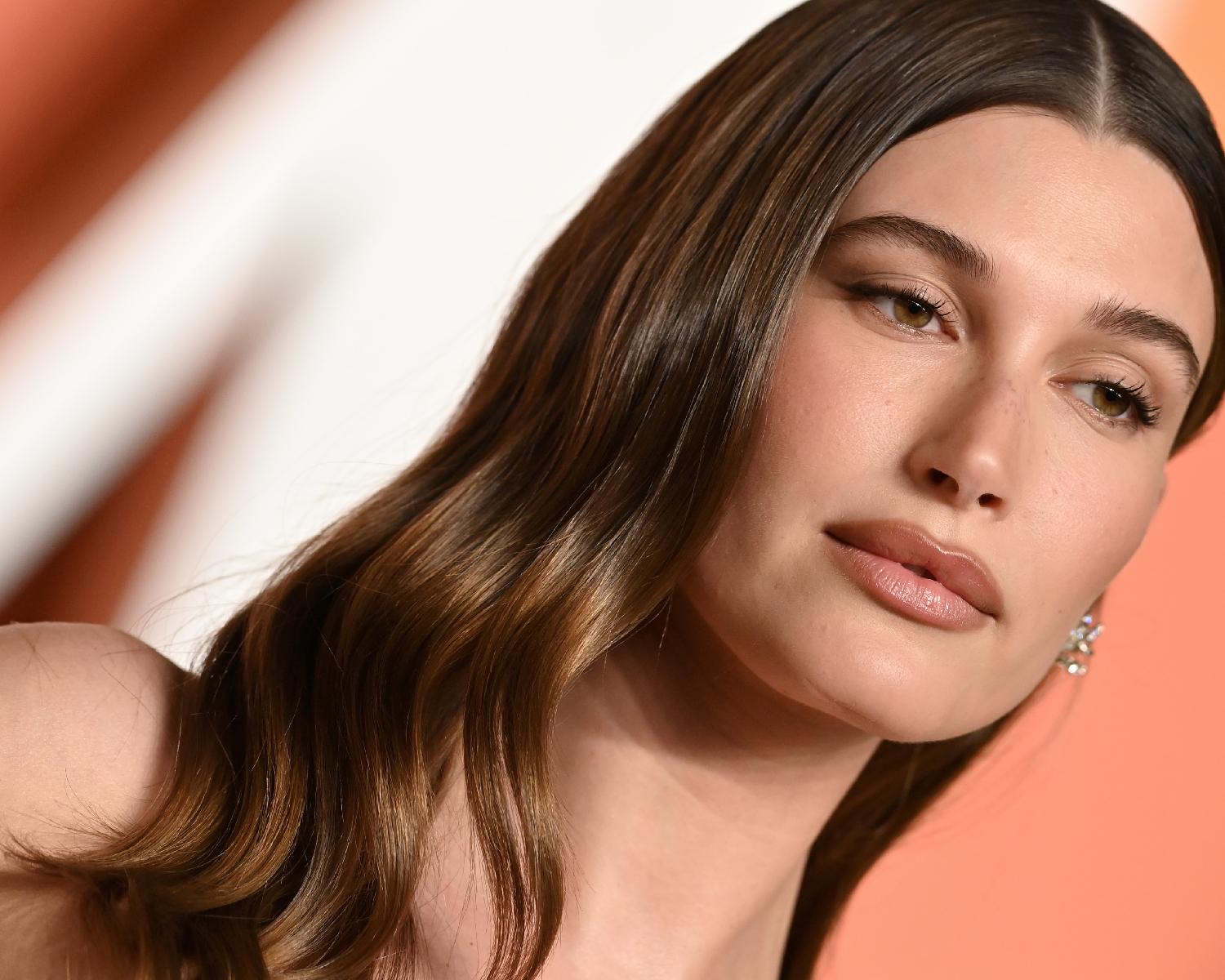 Hailey Bieber with glossy brown hair