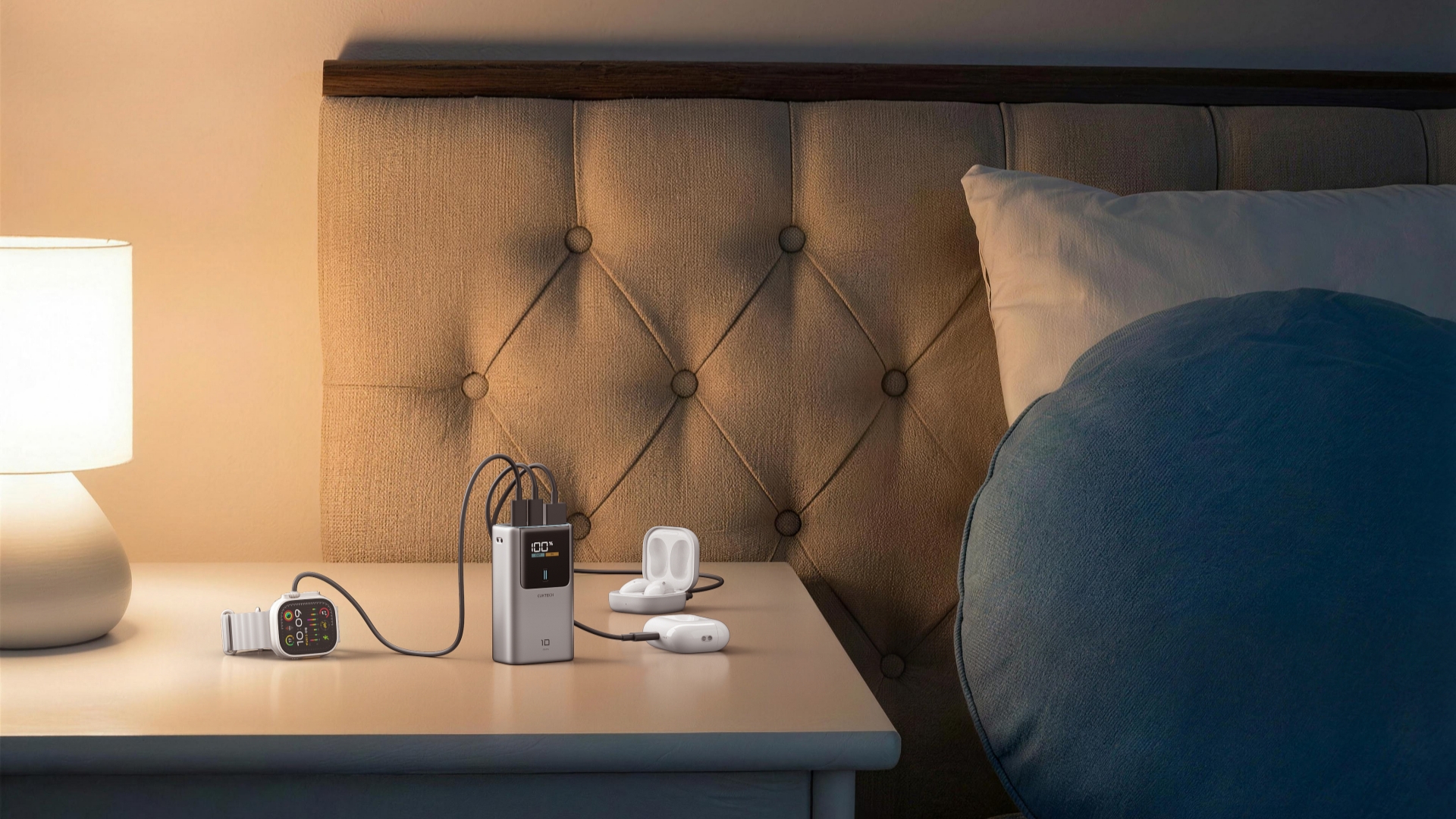 CUKTECH 10 Mini Power Bank charging an Apple Watch and two sets of AirPods on a nightstand