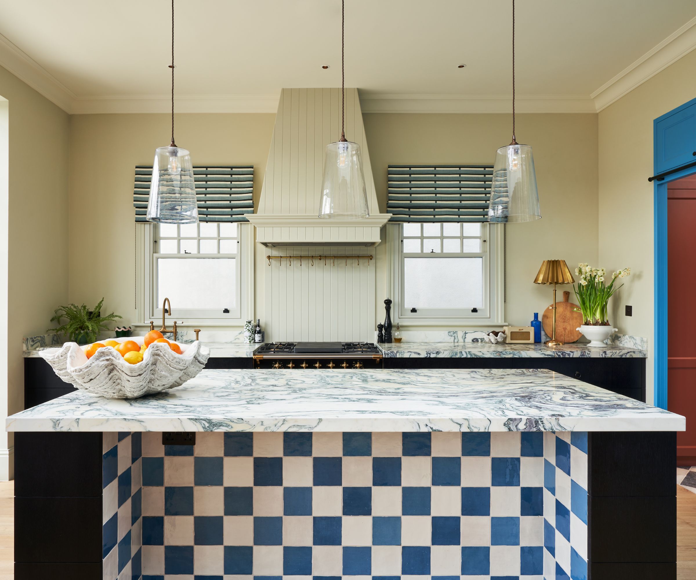 A one wall kitchen with a large island reserved for prep space