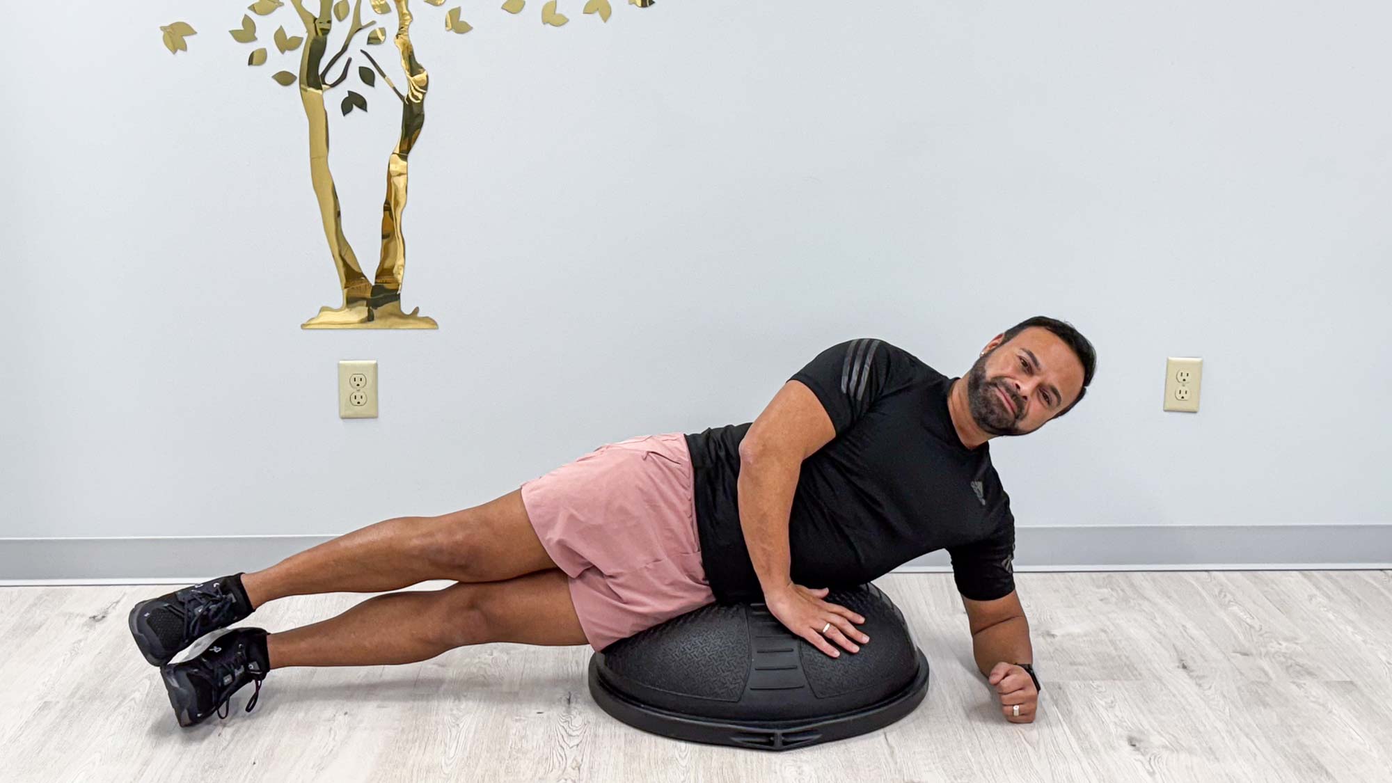 Nico Gonzalez holding a side plank