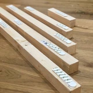 Wooden battens with Command strips attached