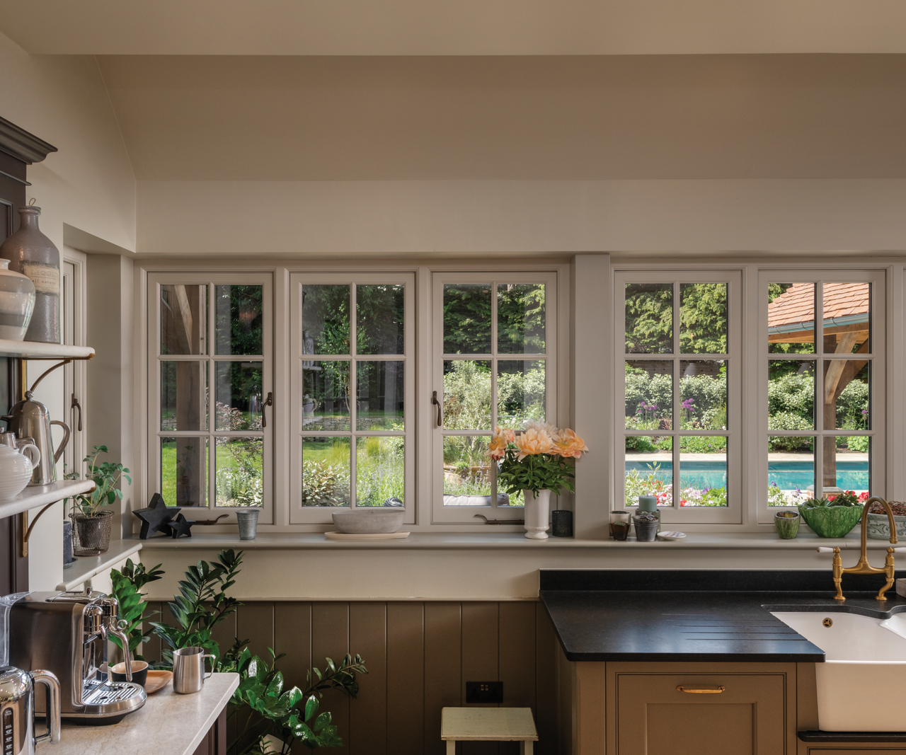 Kitchen windows overlooking the garden and pool