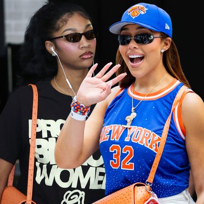 Angel Reese arrived at Game 5 of the WNBA Finals in a Protect Black Women T-shirt and Jordyn Woods's "lucky" orange New York Knicks bag