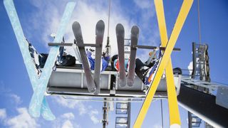 Four skiers on a chairlift