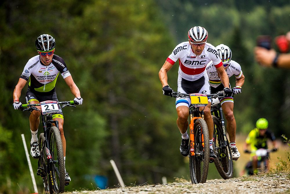 Julien Absalon (BMC Mountainbike Racing Team) and Nino Schurter (Scott-Odlo MTB Racing Team) overtake Cink on lap 4