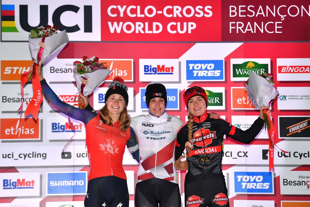 BESANCON FRANCE NOVEMBER 28 LR Maghalie Rochette of Canada on second place race winner Lucinda Brand of The Netherlands and Team Baloise Trek Lions White UCI CycloCross Worldcup Leader Jersey and Denise Betsema of The Netherlands and Team Pauwels Sauzen Bingoal on third place pose on the podium ceremony after the 6th Besanon UCI CycloCross Worldcup 2021 Womens Elite CXWorldCup UCIcyclocrossWC on November 28 2021 in Besancon France Photo by Luc ClaessenGetty Images