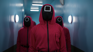 Squid Game: The Challenge participants wearing the masks from the Netflix series