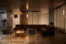 Inside Dr Karen Doherty Shoreditch clinic with leather chairs and concrete floors 