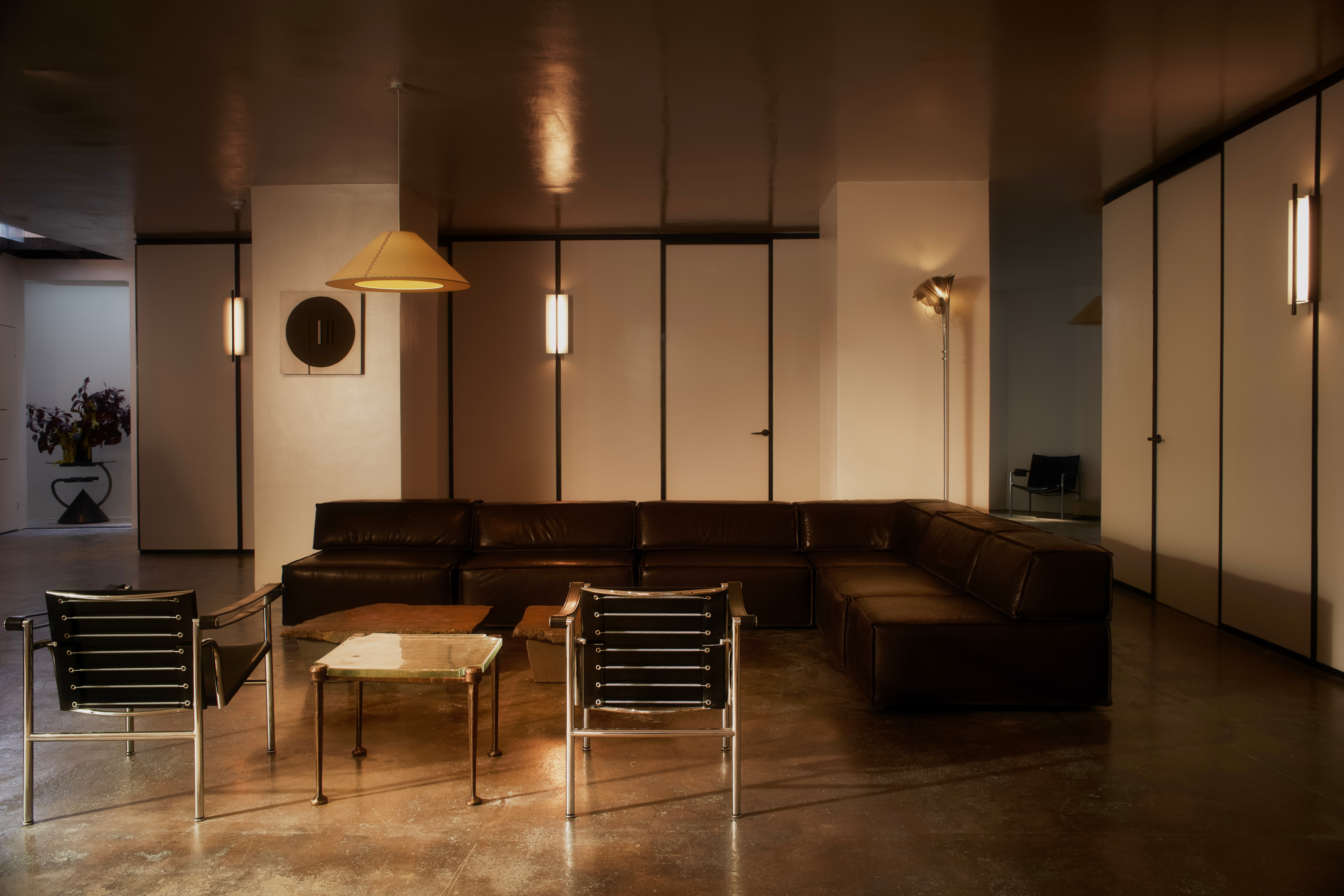 Inside Dr Karen Doherty Shoreditch clinic with leather chairs and concrete floors 