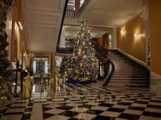 a large art deco christmas tree in a hotel lobby