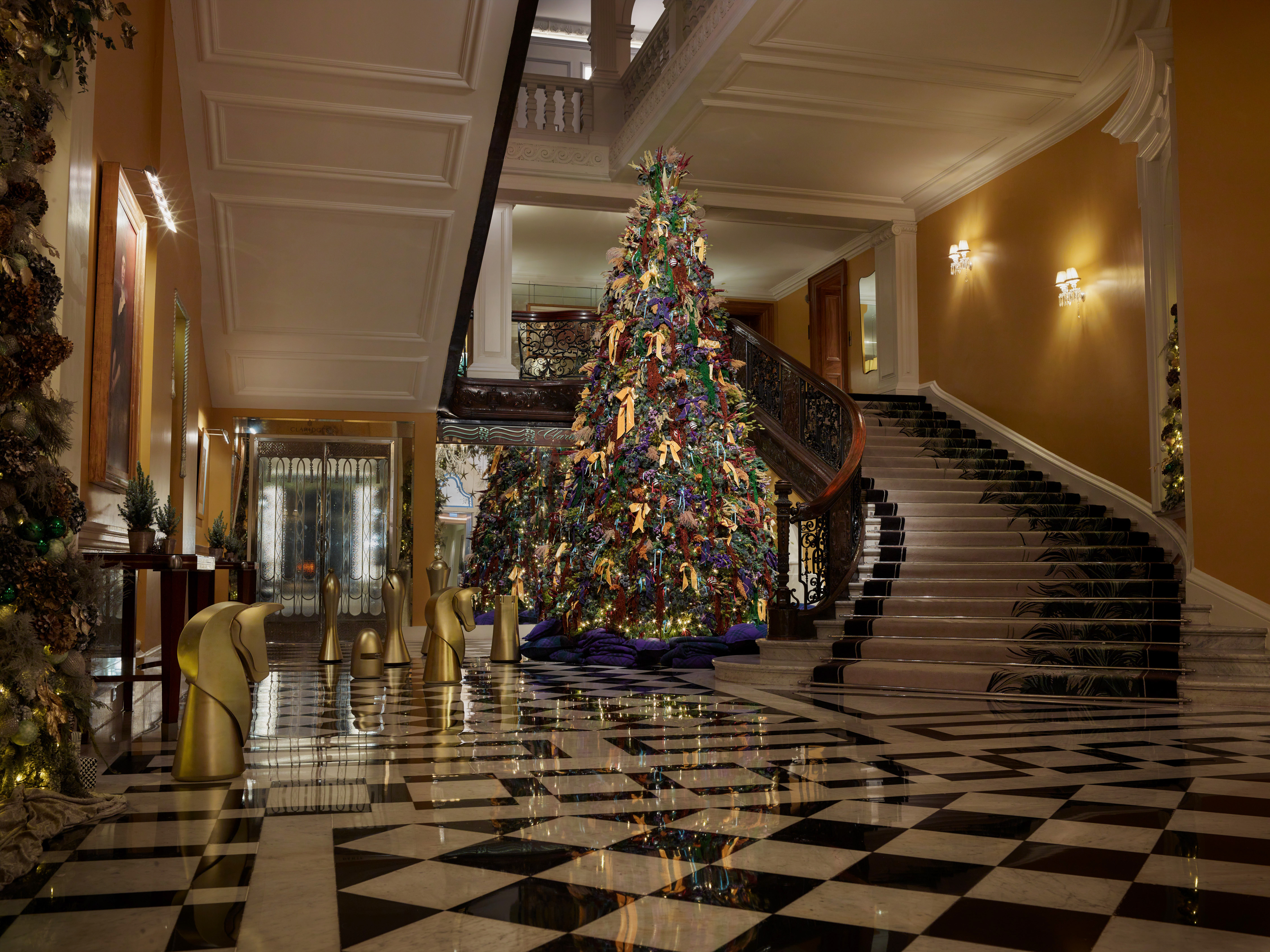 a large art deco christmas tree in a hotel lobby