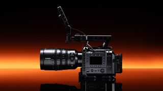 Fujifilm GFX Eterna 55 cinema camera in front of a strip of orange light
