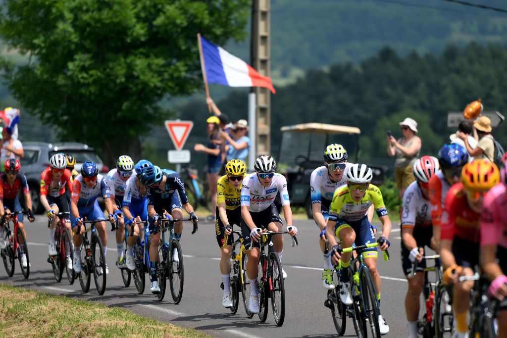 ISSOIRE FRANCE JULY 11 LR Romain Bardet of France and Team DSMFirmenich Jonas Vingegaard of Denmark and Team JumboVisma Yellow leader jersey Tadej Pogacar of Slovenia and UAE Team Emirates White best young jersey and Matteo Jorgenson of The United States and Movistar Team compete during the stage ten of the 110th Tour de France 2023 a 1672km stage from Vulcania to Issoire UCIWT on July 11 2023 in Issoire France Photo by David RamosGetty Images