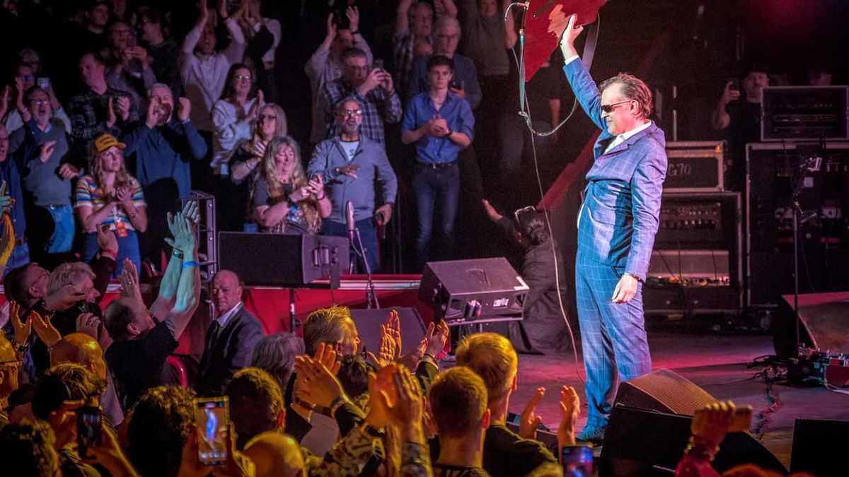 Joe Bonamassa taking a bow onstage