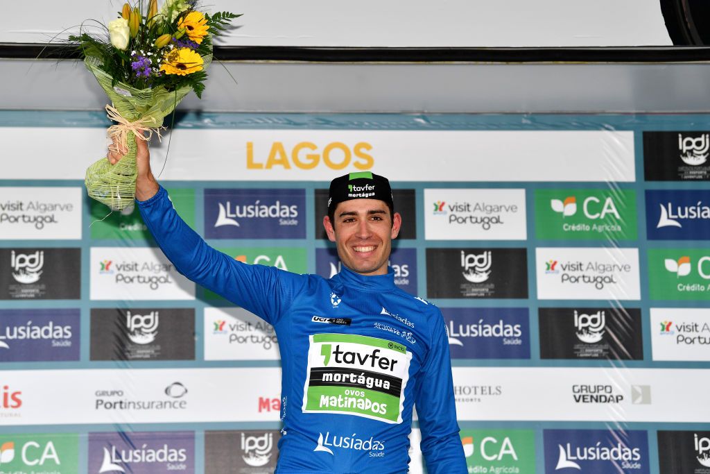 LAGOS PORTUGAL FEBRUARY 16 Joo Carlos Arajo Matias of Portugal and Team TavferMortguaOvos Matinados celebrates winning the blue mountain jersey on the podium ceremony after the 48th Volta Ao Algarve 2021 Stage 1 a 1991km at stage from Portimo to Lagos VAlgarve2022 on February 16 2022 in Lagos Portugal Photo by Luc ClaessenGetty Images