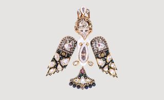 jewellery in the form of a bird, embedded with precious stones