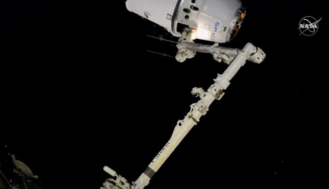 A SpaceX Dragon cargo ship carrying over 5,700 lbs. (2,585 kilograms) of science gear and NASA supplies arrives at the International Space Station on Dec. 8, 2019 during the CRS-19 cargo mission.