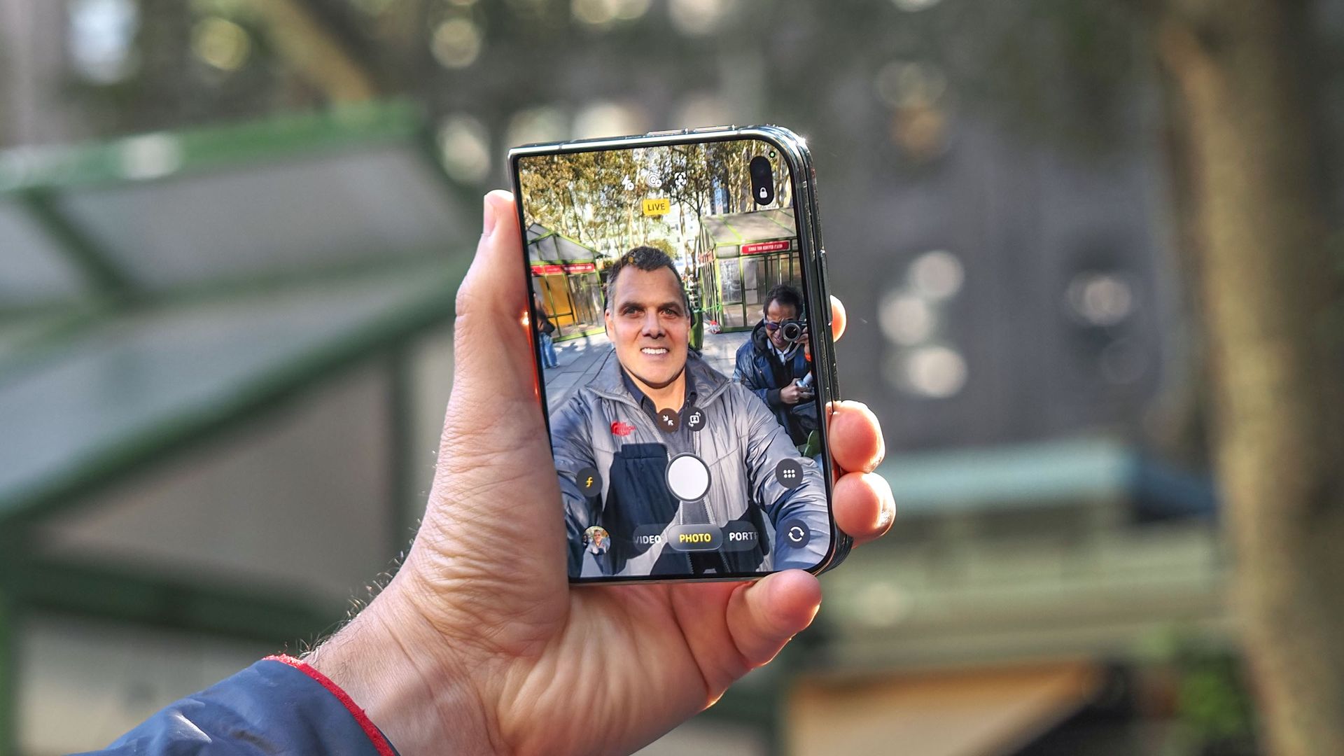 iPhone Duo shown held in hand