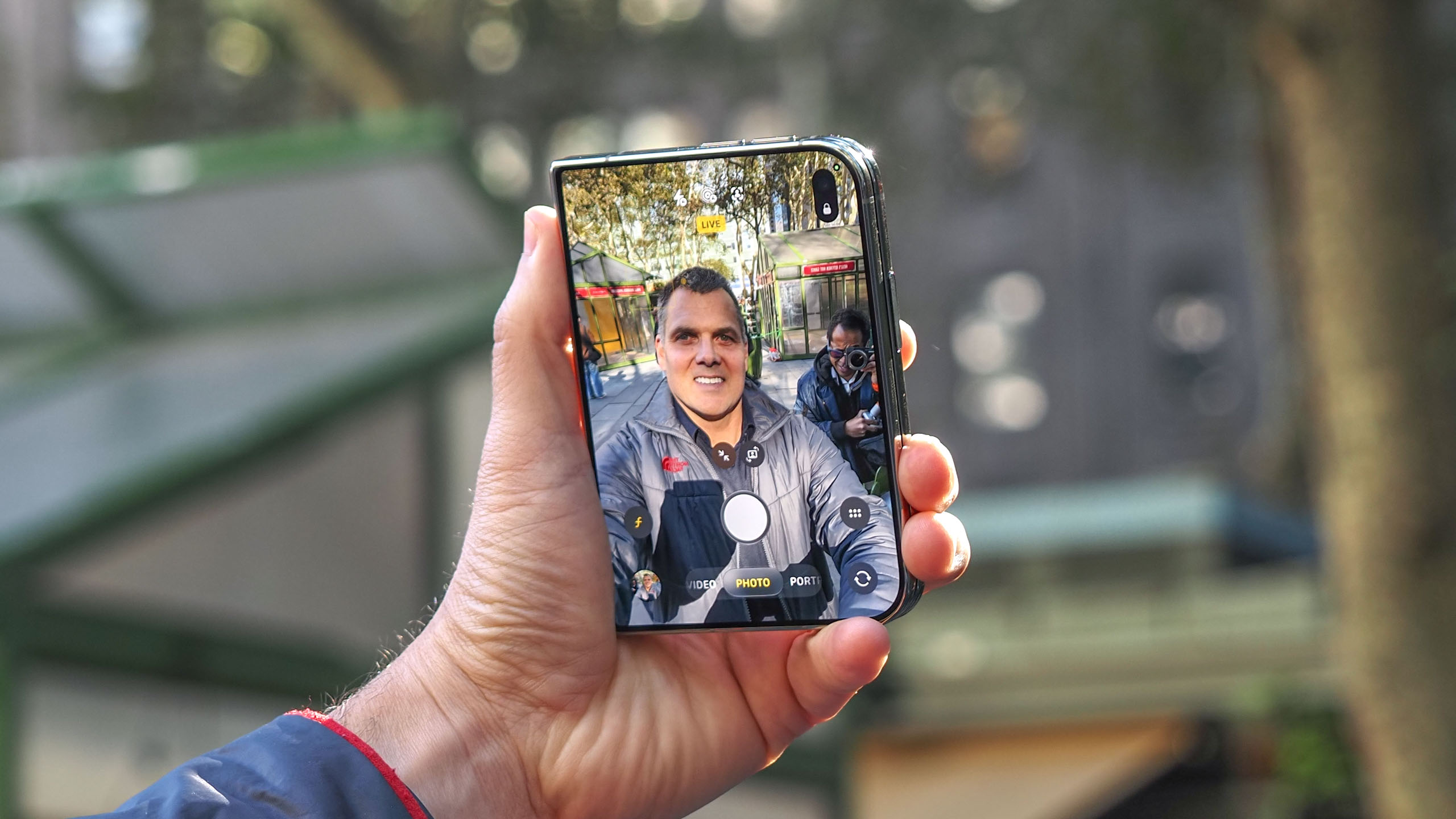 iPhone Duo shown held in hand