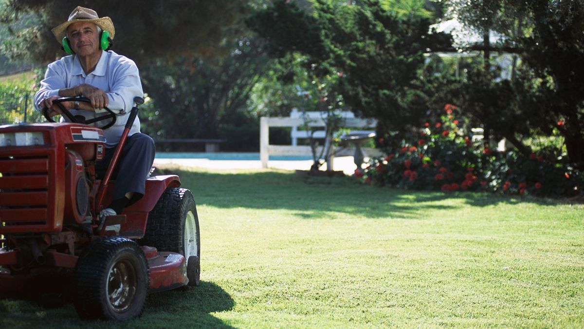 Man on a zero turn lawn mower