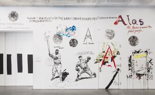 In the museum’s lobby, Pettibon has made his mark directly on the walls