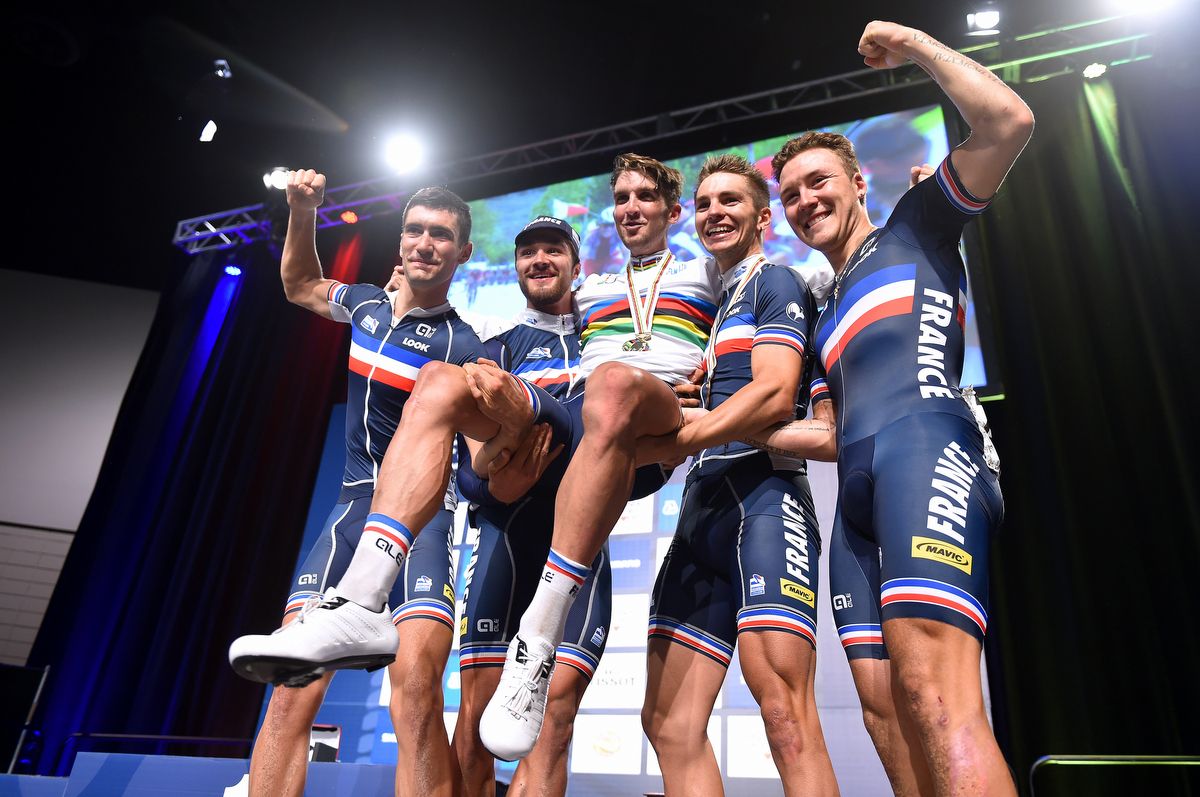 The U23 French team holds Kevin Ledanois aloft