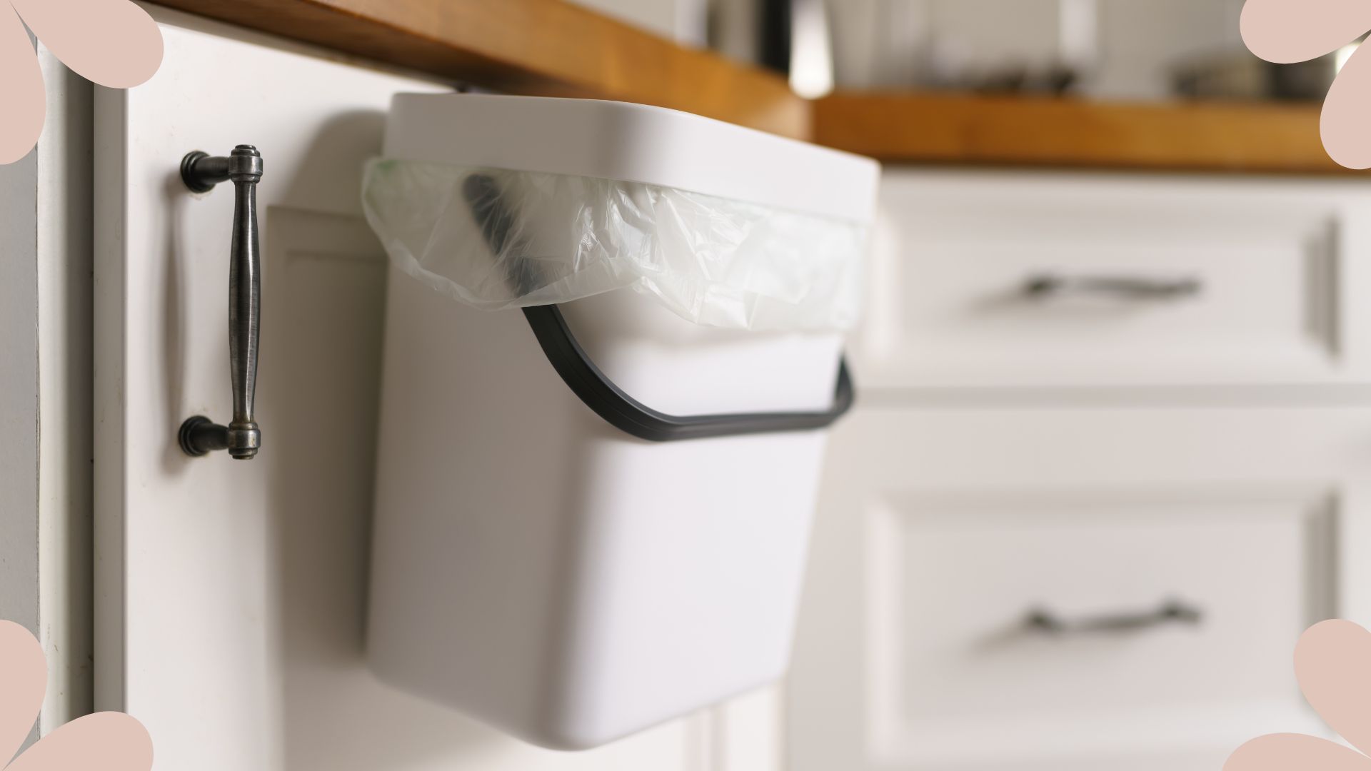picture of a bin suspended on a cabinet door in a kitchen