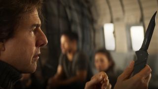 Tom Cruise examines Krieger's knife in a plane in Mission Impossible: The Final Reckoning.