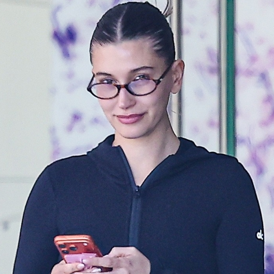 Hailey Bieber tapped into the sportif trend in track pants, a fitted jacket, and chunky black sneakers