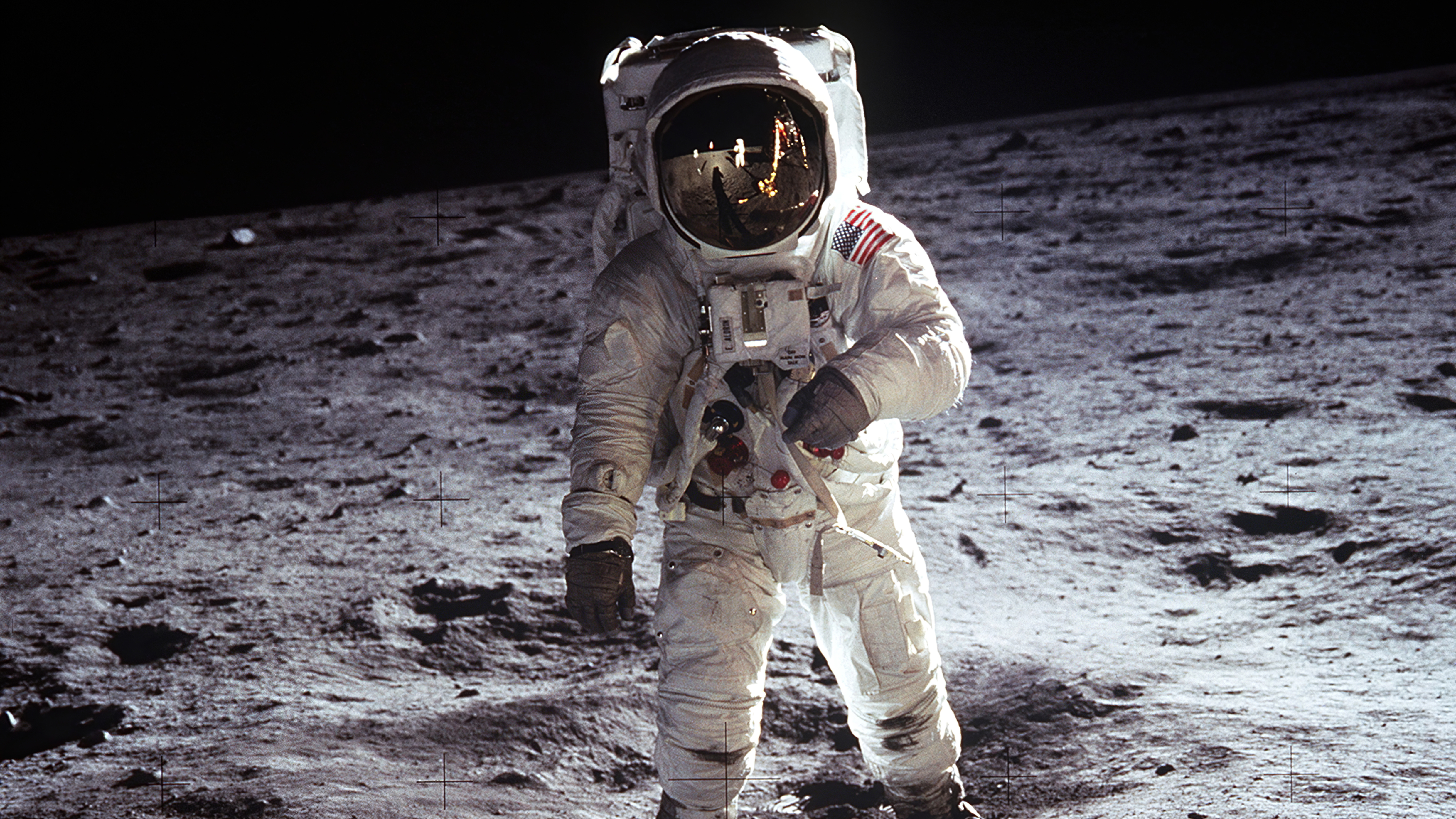 Astronaut Buzz Aldrin walks on the surface of the moon near the leg of the lunar module Eagle during the Apollo 11 mission, 1969.