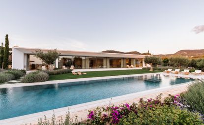 Exterior of Sabina Estates Villa by Tara Bernerd, with pool and gardens, an Ibiza retreat