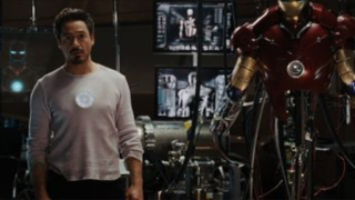 Iron Man stands in his lab