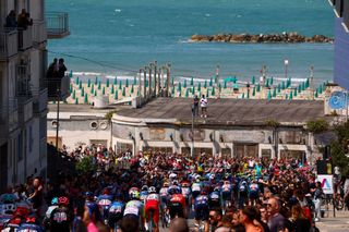 The pack rides in Termoli during the 11th stage of the 107th Giro d'Italia cycling race, 207km between Foiano di Val Fortore and Franca Villa al Mare, on May 15, 2024. (Photo by Luca Bettini / AFP)