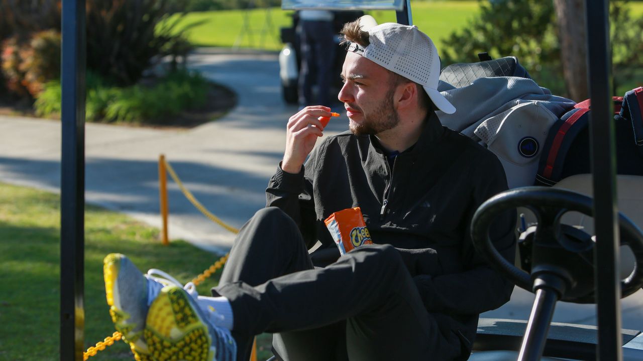 Dan Parker in a golf buggy